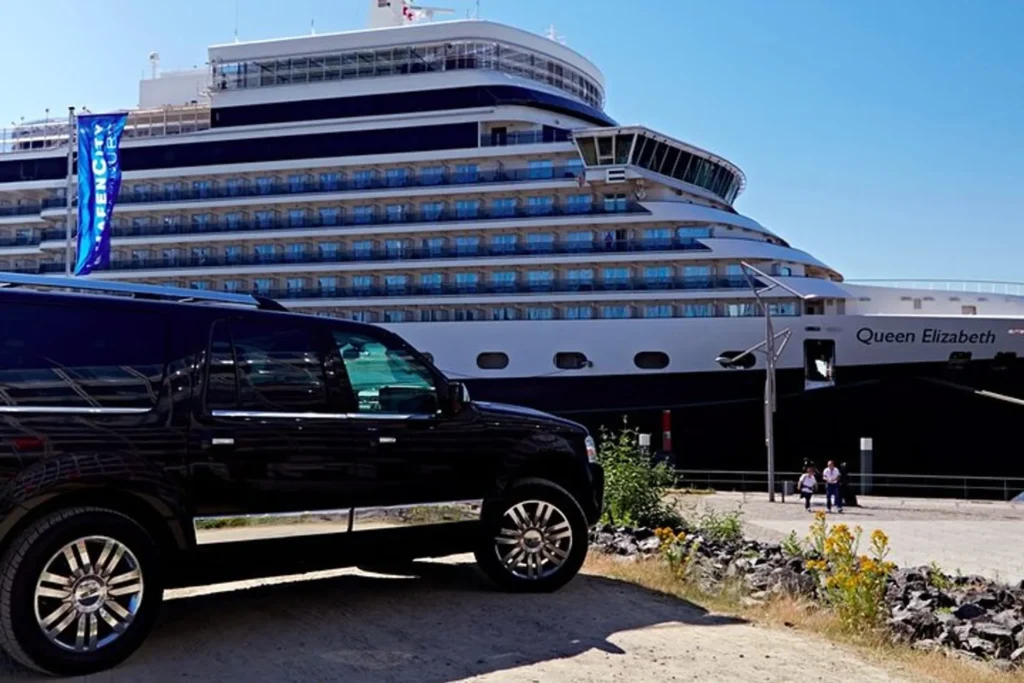 Black car parked for cruise ship transfers at the port