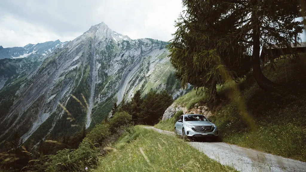 Car driving through hills on a long distance taxi service route